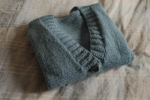 knitting cardigan blue folded