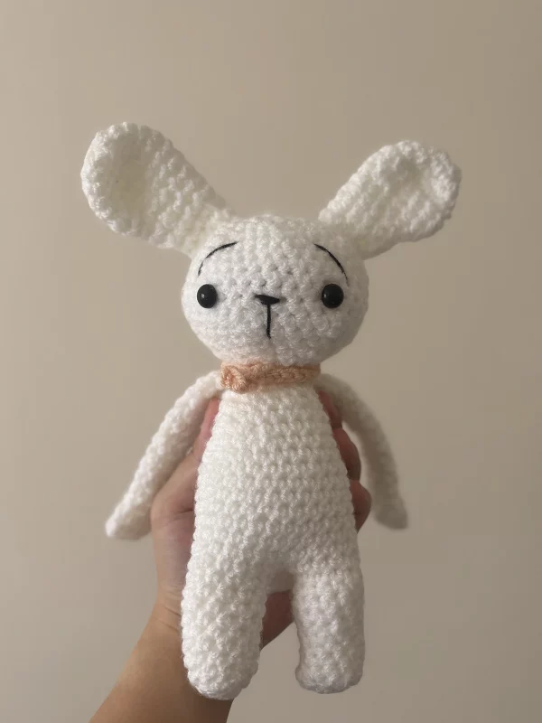 crochet bunny with little pink scarf front